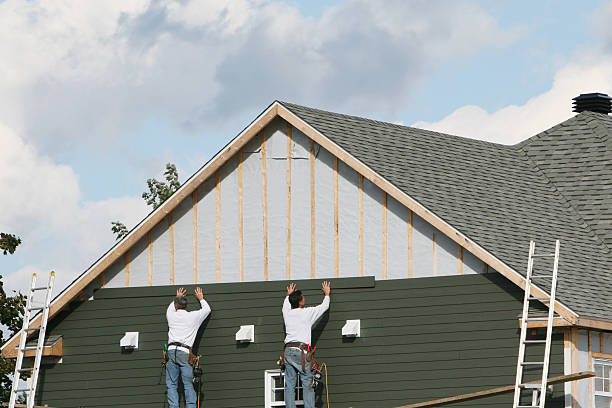 Professional Storm Damage Siding Repair technician working in Clinton, SC